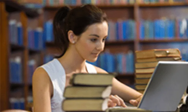 student with laptop and books