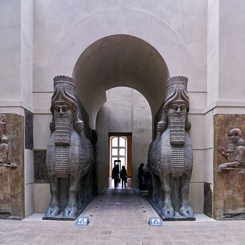 Pair of human-headed winged bulls flanking a museum gateway